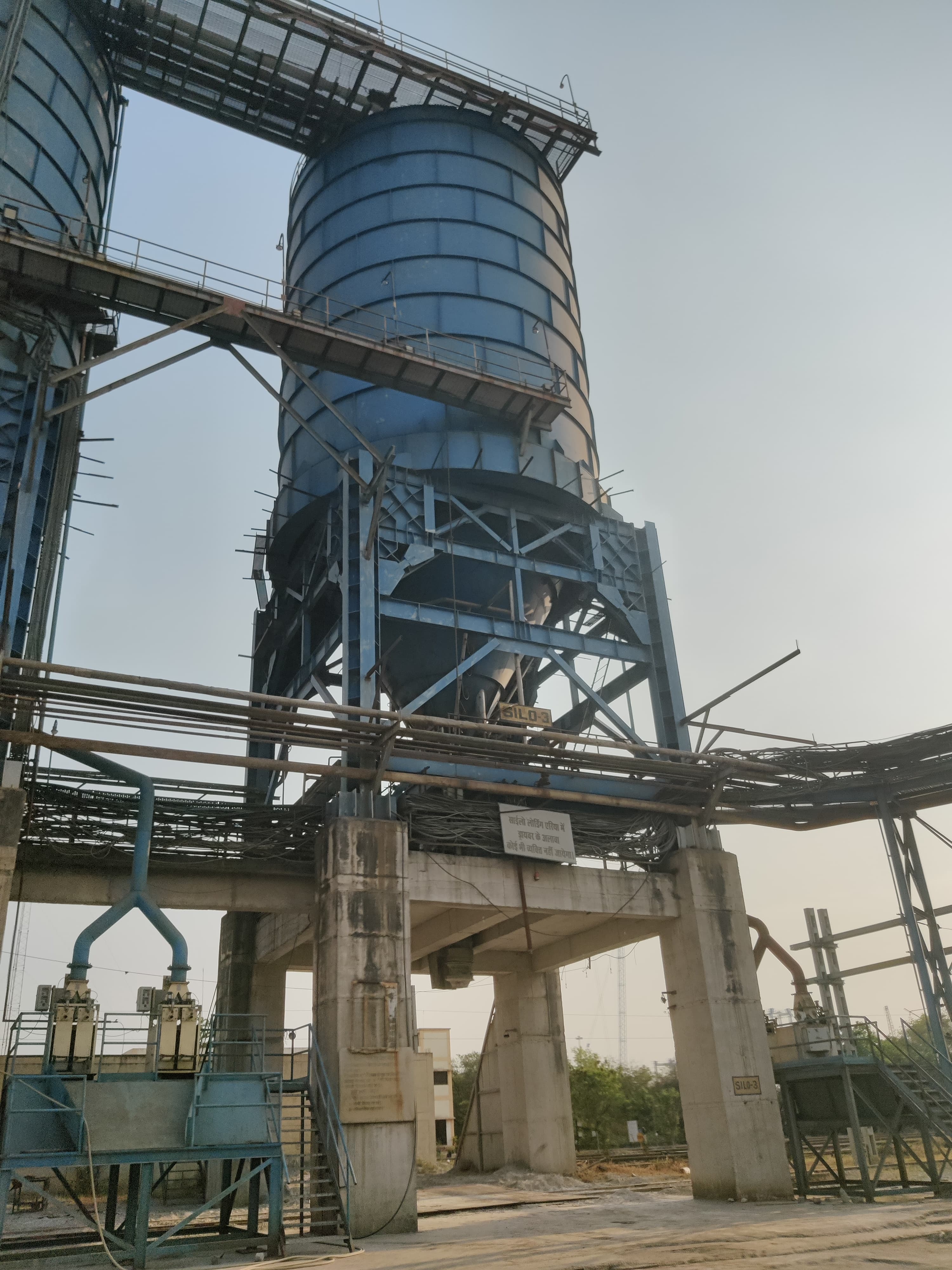 Fly ash storage silos being inspected at a thermal power plant